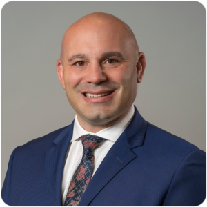 Bancroft's Senior Vice President of Children's Services Dennis Morgan's headshot wearing a suit and tie